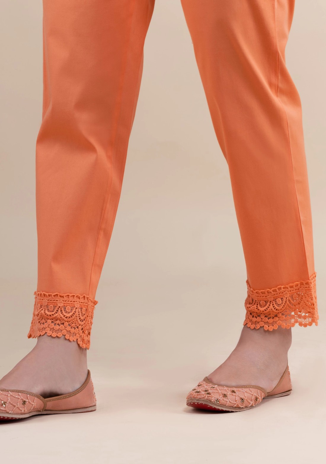 Peach Cotton Lycra Narrow Hem Pants With Lace