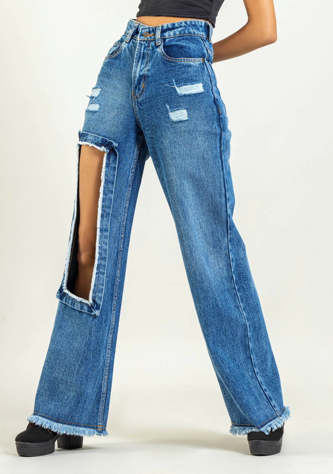 Ultra high waisted wide leg denim jeans with frayed outlet cutout pattern